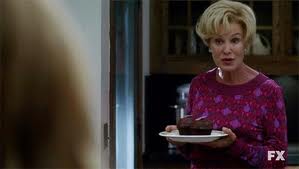 "Sure, I thought about bringing you something from one of those trendy little shops that sell the fancy sort of cupcake, but you don't strike me as a 'fancy cupcake' kind of person, so why on earth should I waste perfectly good money that could be spent on cigarettes, whiskey and the affections of a twenty-five year old boy-toy with six-pack abs and a brain the size of a walnut? Here. I picked this up at that grimy Korean market on the corner. It's a Devil Square. Made by a culinary genius who calls herself 'Little Debbie.' Welcome to the freaking neighborhood."