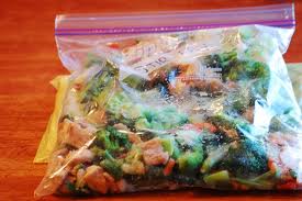 Emergency Technicians and forensic detectives gather victims in body-bags for transport to the Medical Examiner's lab.