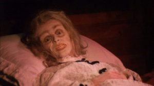 ... her once-grandmotherly face frozen in what appears to be a mask of abject and unrelenting terror."